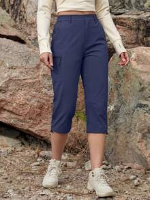 Cavva 女士七分防水裤，透气速干，轻便柔软，中腰设计，弹性裤脚，可调节裤脚开口，5个安全口袋，适合徒步、露营和休闲穿着。 - 藏蓝色 - 查看 2