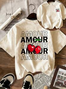 Áo thun nữ dáng rộng "AMOUR" in hình quả anh đào, cổ tròn, tay ngắn, kiểu dáng rộng rãi thoải mái, phù hợp cho mùa hè, phong cách lãng mạn, phong cách Y2K, du lịch sa mạc, mùa lễ hội, đi biển, trang phục đi nghỉ mát. - Màu be - Xem 2