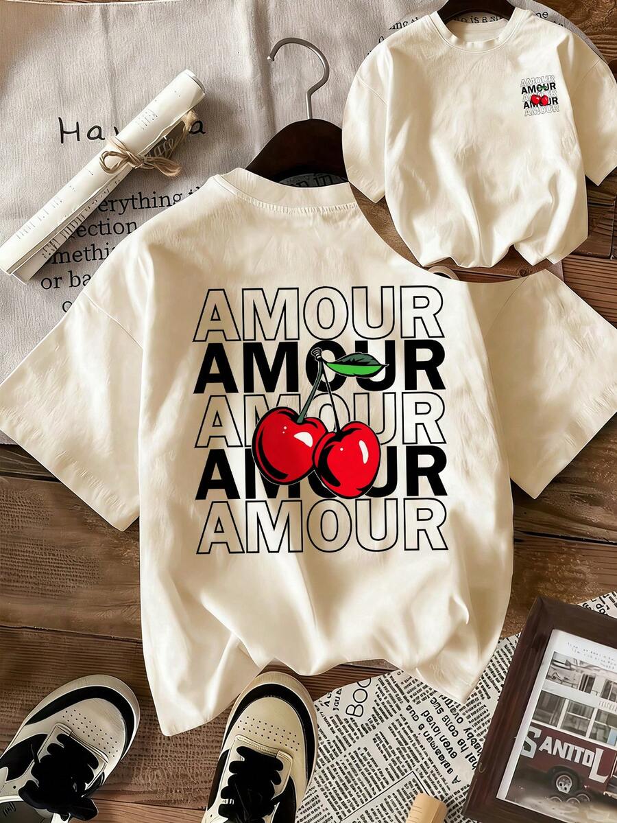 Áo thun nữ dáng rộng "AMOUR" in hình quả anh đào, cổ tròn, tay ngắn, kiểu dáng rộng rãi thoải mái, phù hợp cho mùa hè, phong cách lãng mạn, phong cách Y2K, du lịch sa mạc, mùa lễ hội, đi biển, trang phục đi nghỉ mát.