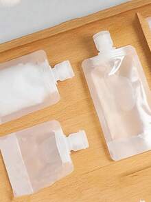Bộ 1 túi đựng mỹ phẩm và sữa dưỡng thể di động, kèm chai silicon du lịch, túi hút chân không đựng dầu gội, mỹ phẩm có vòi đứng tái sử dụng, túi đựng rỗng có thể đổ đầy lại, chai du lịch chống rò rỉ, dùng để đựng dầu gội, mỹ phẩm và sữa dưỡng thể, đồ dùng cần thiết khi đi du lịch, đồ dùng ký túc xá, quà tặng tựu trường. - Nhiều màu - Xem 4