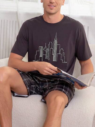 Bộ đồ ngủ nam 2 món gồm áo sơ mi ngắn tay cổ tròn in họa tiết City Line và quần short kẻ caro, kiểu dáng thoải mái và giản dị.