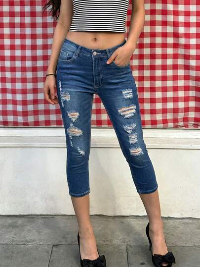 Jeans elásticos ajustados de talle alto 7/8 para mujer con efecto desgastado