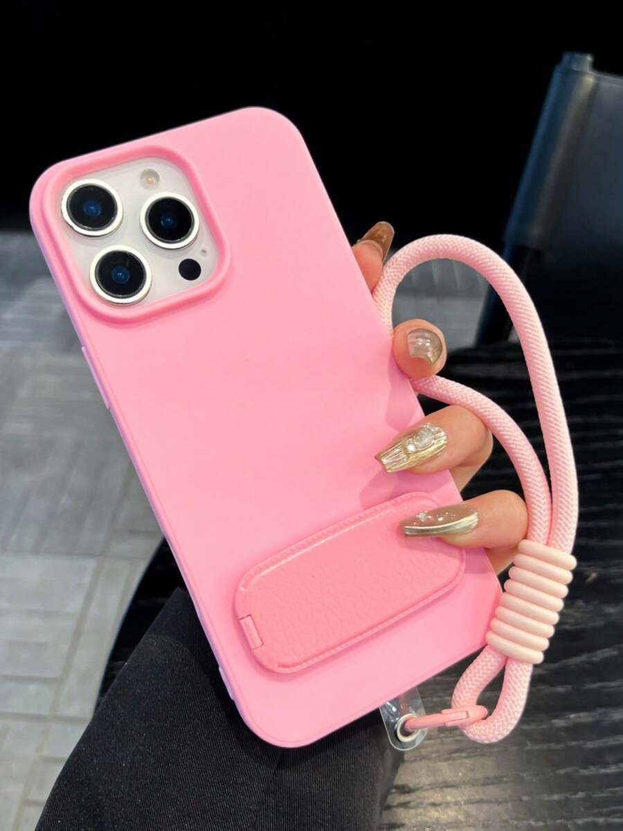 1个ins风柔粉色手机壳，配有同色挂绳和支架，内置镜子，防震、防滑、防刮，兼容 17 Pro Max、17/16/15/14/13/12/11，是情人节/新年礼物的完美之选。