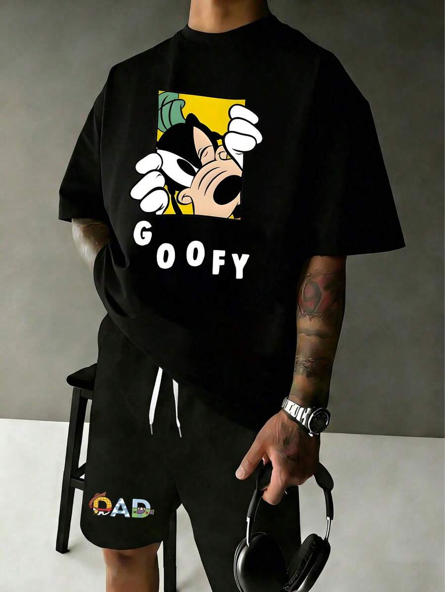 2 PCS Disney Goofy Short Sleeve T-Shirt & Shorts Set: Black Tee With Peeking Goofy Graphic And Bold "GOOFY" Lettering, Matching Black Shorts With Colorful "DAD" Print, Comfortable Cotton Fabric, Perfect For Casual Wear, Family Outfits And Disney Fans, Ideal Gift For Dads - 黑色 - 查看 1