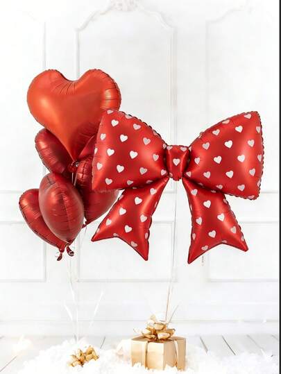 红色蝴蝶结装饰气球套装，包含大型哑光红色蝴蝶结气球和红色心形铝箔气球，适用于生日、派对、求婚、婚礼、单身派对、周年纪念等场合。