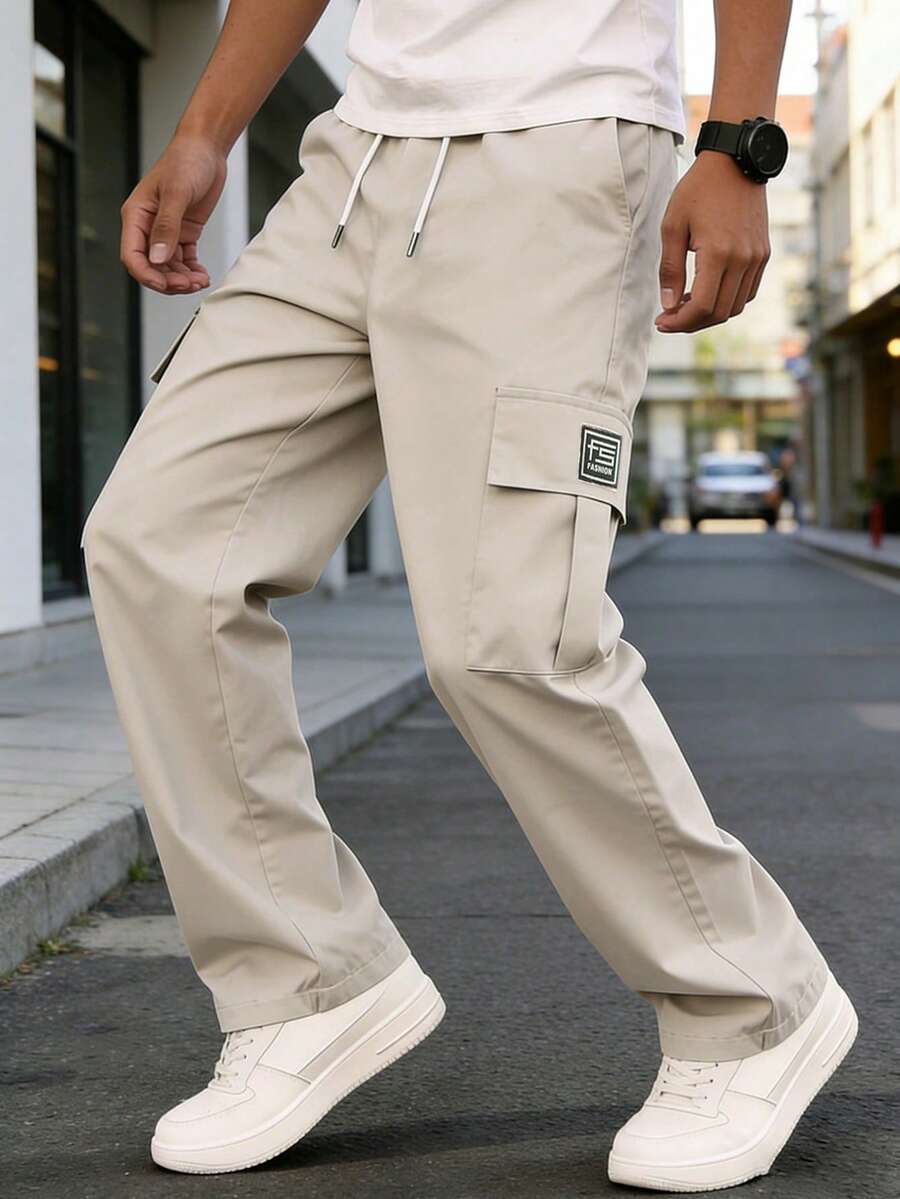 Pantalones cargo de pierna recta y holgados para hombres con bolsillos laterales y cintura con cordón, estilo casual de cargo para primavera y otoño - Beis - Ver 1
