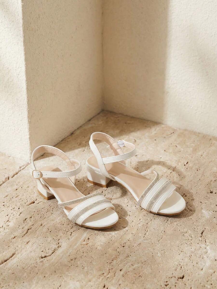 Giày sandal cao gót đính đá trắng cho bé gái mùa hè 2026, quai ngang điều chỉnh được, giày công chúa thanh lịch cho trẻ em, sandal đính đá trắng, gót dày và khóa điều chỉnh, chống trơn trượt. - trắng - Xem 1