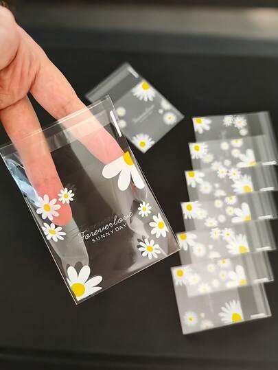 100 piezas de bolsas de plástico transparentes autoadhesivas con estampado de margaritas, adecuadas para regalos de baby shower y fiestas de cumpleaños infantiles