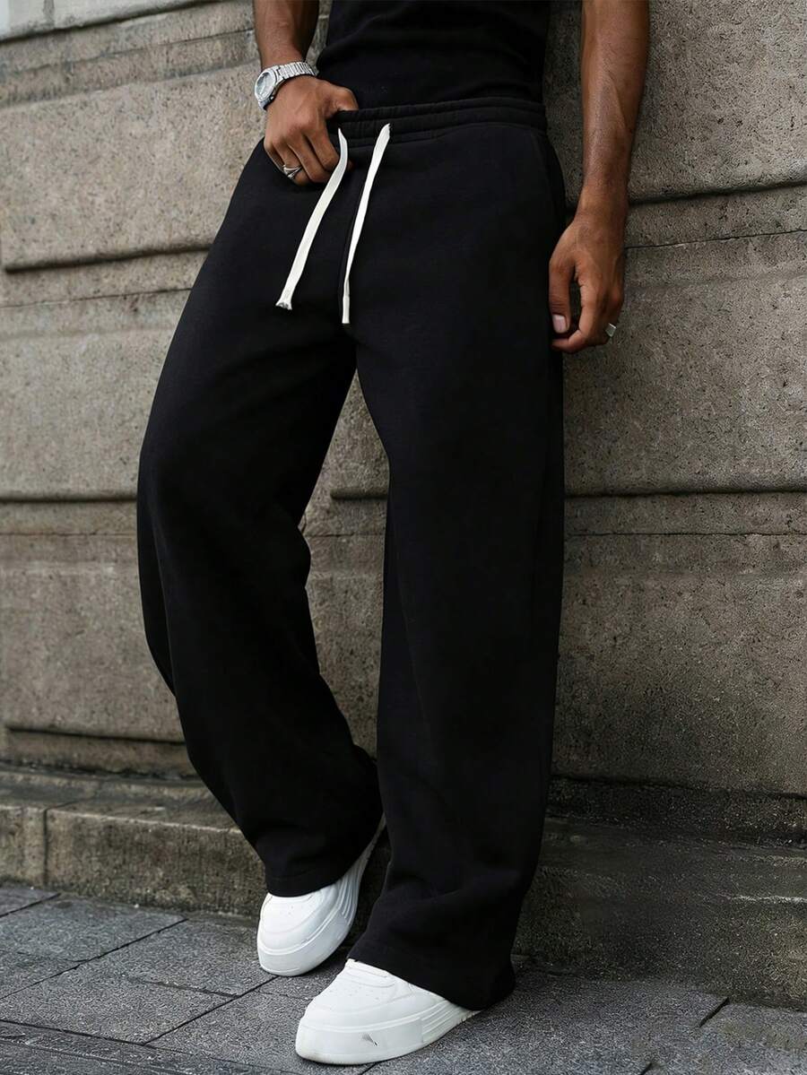 This Men's Casual Sweatpants Feature A Loose, Straight-Leg Silhouette With A Thermal Lined For Comfort And Drape. Suitable For Both Indoor And Outdoor Wear, It Also Makes A Great Gift For Couples. The Pants Are Made Of 100% Polyester Fabric And Have A Drawstring Waistband For Adjustable Fit, Available In Multiple Colors. - Black - View 1