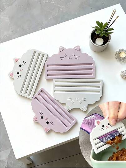 1/2 猫粮挤压器 - 有效挤压袋装猫粮，最大限度地利用剩余猫粮。这款挤压器非常适合注重清洁喂食和操作简便的猫主人。它适用于各种猫粮包装袋，易于清洁，保持卫生。材料提取自植物。