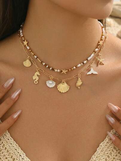 Bộ 2 mặt dây chuyền hình sinh vật biển phong cách đảo Bohemian, vòng cổ choker đính hạt thủ công, bộ trang sức thời trang dành cho nữ, phù hợp để đeo hàng ngày, đi biển, dự tiệc, lễ hội âm nhạc. Dây chuyền thủ công có thể được tùy chỉnh độ dài.