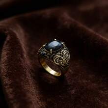 A Ring With A Gorgeous And Highly Personalized Style. The Ring Body Features A Black And Gold Dual-Tone Design, With The Gold Part Adorned With Intricate Openwork Floral Patterns And Scroll Motifs. The Lines Are Smooth And Multi-Layered, Showcasing The Refined And Luxurious Aesthetics Of Classical Palace Style. Suitable For Wearers Who Pursue Unique Tastes And Vintage Styles. - Black - View 13