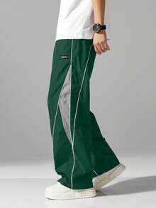 Quần jogger nam phong cách đường phố với sọc bên hông, túi và dây rút ở eo, quần thể thao phối màu tương phản, phù hợp cho thời gian rảnh rỗi và mặc dạo phố. - màu xanh lá - Xem 7