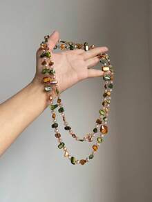 Một chiếc vòng cổ đính hạt phong cách Bohemian nhiều màu sắc với mặt dây chuyền hình vỏ sò hai lớp, thích hợp cho kỳ nghỉ sang trọng nhẹ nhàng và giản dị. - Nhiều màu - Xem 3