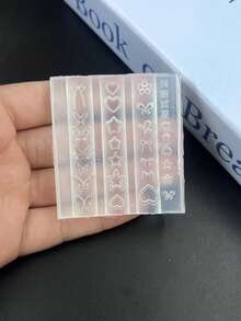 1个精美城堡美甲模具，包含丝带、蝴蝶结、珍珠、星星等透明元素 - 無色 - 查看 10