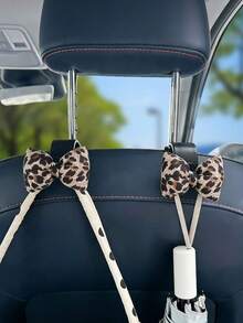 1/2 piezas Lindo colgador de respaldo de asiento de coche con lazo de estampado de leopardo - Diseño de lazo de leopardo, bolsa de almacenamiento en el respaldo del asiento, llaves, accesorios para el coche - Se ajusta a la mayoría de los vehículos - Gancho para lazo con estampado de leopardo - Ver 2