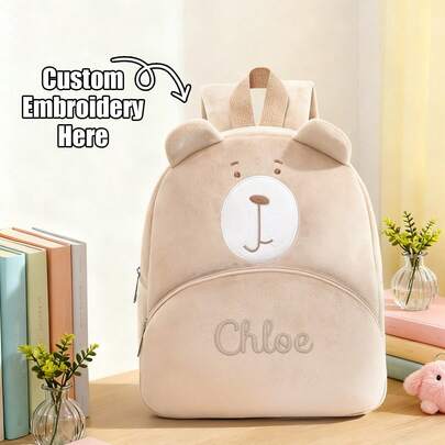 Chiếc ba lô thêu hình mặt gấu bông đơn giản này là một chiếc túi đeo vai thời trang, mềm mại và bông xốp. Bạn có thể cá nhân hóa nó với tên của mình, đây là một chiếc ba lô kiểu dáng mùa thu/đông di động, dung tích lớn, có tai, túi phía trước, tay cầm có khóa kéo và dây đeo vai có thể điều chỉnh. Nhẹ, bền và hoàn hảo cho những chuyến đi chơi thông thường, lý tưởng cho các hoạt động ngoài trời, dã ngoại và du lịch hàng ngày. Đây là một món quà độc đáo cho kỳ nghỉ, thoải mái và thiết thực, và cũng là một món quà sinh nhật tuyệt vời.