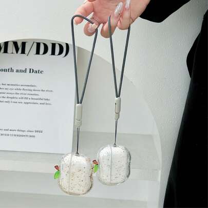 苹果形状的耳机盒，饰有透明金色碎片图案，兼容 Pro 2/Pro 耳机盒，并配有时尚挂绳。