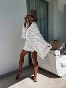 Bộ đồ hai mảnh mùa hè Sylvia dành cho nữ, áo và quần short dệt kim tay loe xuyên thấu, dáng rộng, thoáng khí, mang đến vẻ gợi cảm thoải mái, thích hợp cho công sở, đi biển hoặc nghỉ mát. Màu trắng. - trắng - Xem 5