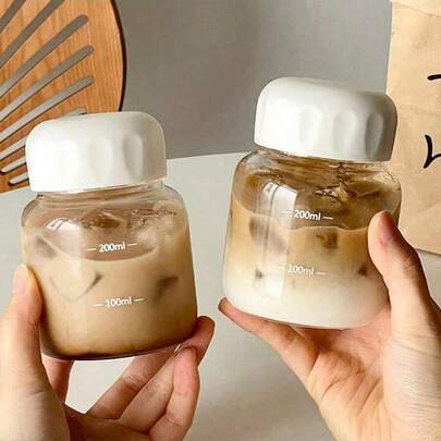 Bộ 2 bình sữa thủy tinh mini cầm tay, cốc cà phê thủy tinh mini cầm tay, bình nước có nắp, cốc uống sữa, cốc trà chịu nhiệt, cốc du lịch kín dùng hàng ngày trong nhà bếp, có thể rửa bằng máy rửa chén, thích hợp đựng sữa, cà phê, trà hoa, v.v.