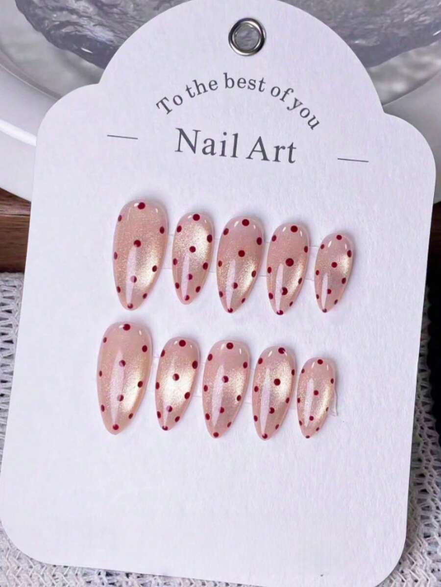 10片手工杏仁形粉色闪粉猫眼红色波点情人节设计假指甲。采用手工绘制的粉色闪粉猫眼效果，并点缀红色波点。这些优雅、浪漫、简约的按压式假指甲品质上乘，性感奢华。适合日常佩戴、约会、音乐会和轻度商务场合，是送给女士和女孩的绝佳礼物。 - 彩色 - 查看 1