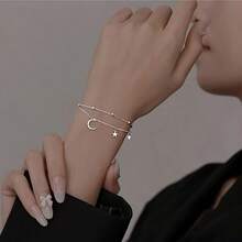 Vòng tay sao và trăng hai lớp mạ chân không sang trọng - Không gây dị ứng, mạ vàng trắng đính đá Cubic Zirconia - Món quà tinh tế hoàn hảo dành cho phái nữ vào Ngày Valentine, Giáng sinh hoặc Ngày của Mẹ. - Ngôi sao - Xem 2