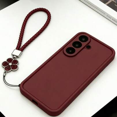 1个简约高级酒红色防震手机壳，配有闪亮花朵编织腕带，防震、防滑、防刮，兼容三星S20-S25系列、Note 14/13/12系列和A56 5G，是情人节/新年礼物的完美之选。