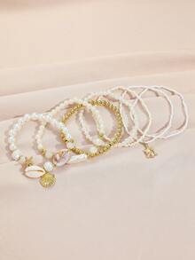 Bộ 7 vòng tay xếp lớp bằng vỏ sò, ngọc trai và hạt cườm, thiết kế phong cách Boho có thể xếp chồng lên nhau, thích hợp cho nữ, đi biển, nghỉ mát, họa tiết vỏ sò ngẫu nhiên, ý tưởng quà tặng tuyệt vời (Số lượng hạt cườm không cố định theo chiều dài). - bộ vòng tay - Xem 5