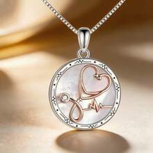 Dây chuyền hình trái tim màu vàng hồng có hình ống nghe và máy đo điện tâm đồ. - Hoa hồng vàng - Xem 1