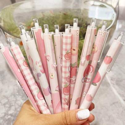 Set de 12 bolígrafos de tinta negra de 0.5mm con botón pulsador y diseños gráficos de melocotón, de color rosa lindo para niñas. Esenciales de papelería para volver a la escuela y firmar en la oficina.