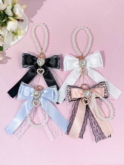 1件女士精致甜美水晶爱心装饰蕾丝丝带仿珍珠链蝴蝶结吊坠，适合装饰包包、衣服、钥匙等各种场合，是送给她的贴心礼物。