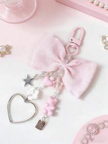 1 chiếc móc khóa hình gấu nơ xếp nếp dùng để kẹp sổ kế hoạch, dây treo balo cho bé gái. - Nhiều màu - Xem 3