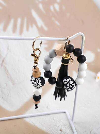 Conjunto de 2 pulseiras alegres em tons pastel com pingente de coração e contas - Chaveiro de silicone com contas rosa vibrante e menta com tassel, acessório fofo e feminino para bolsas, ideal para presentear mães, pais, formaturas e professores.