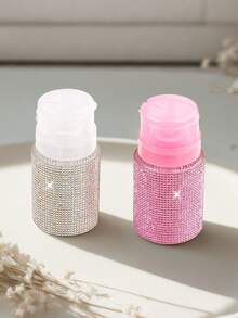 Chai nước tẩy sơn móng tay màu hồng và trắng với thiết kế hình kim cương và nắp nhấn tiện dụng. Dụng cụ chăm sóc móng: Chai đựng sơn móng tay bằng nhựa với thiết kế họa tiết kim cương, có thể đổ đầy lại, chai nước tẩy sơn móng tay có nắp nhấn. - Nhiều màu - Xem 5