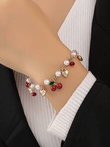 1 chiếc vòng tay thời trang nữ hình hoa anh đào với mặt dây chuyền hình trái tim đính ngọc trai. - quả anh đào - Xem 7