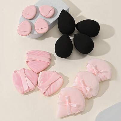 Bộ dụng cụ trang điểm gồm 4 bông mút hình giọt nước đen + 4 bông mút ngón tay hồng + 3 miếng mút đệm nhiều màu + 3 bông mút hình bướm hồng, mềm mại và thân thiện với da, thích hợp sử dụng tại nhà hoặc bởi chuyên gia trang điểm.