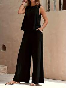 The Two-Piece Set Is Made Of Soft, Lightweight, And Breathable Fabric, Designed To Provide Ultimate Comfort And A Relaxed Style. The Sleeveless Vest Features A Classic Round Neck Design With A Loose Fit, Providing Cool Coverage For Warm Summers, While The High Waisted Wide Leg Pants Hang Smoothly, Creating A Graceful And Charming Silhouette That Elongates Your Legs. Whether You're Strolling Around At Home, Strolling Along The Beach, Or Exploring A New City On Vacation, This Set Can Provide All Day Comfort Without Compromising Fashion. - 黑色 - 查看 2