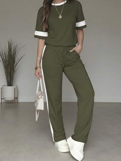 Bộ 2 món dành cho nữ, áo tay ngắn cổ tròn phối màu tương phản và quần ống đứng cạp cao có dây rút, thích hợp cho mùa xuân/hè.