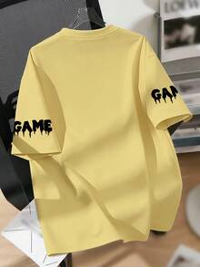 青少年男孩寬鬆版印花T恤，潑墨遊戲控制器圖案，袖口「GAME」滴墨標語，休閒落肩上衣，適合學校、遊戲活動、日常休閒穿著，夏季 - 黃色 - 查看 2
