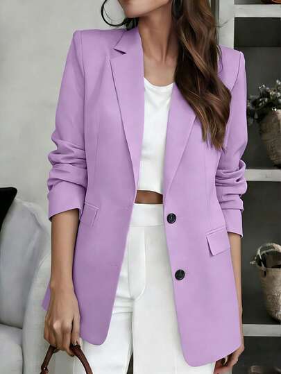 Áo khoác blazer nữ màu tím oải hương thanh lịch, tay dài, dáng suông, cổ ve lật, chất liệu dệt kim, phù hợp cho công sở và mặc hàng ngày.