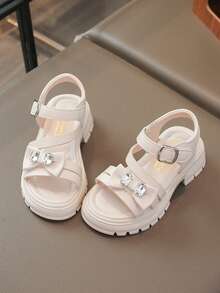 Giày sandal cho bé gái, giày La Mã đế dày thời trang mùa hè mới, giày công chúa hở mũi đính nơ đính đá, đế mềm đi biển. - Màu be - Xem 11