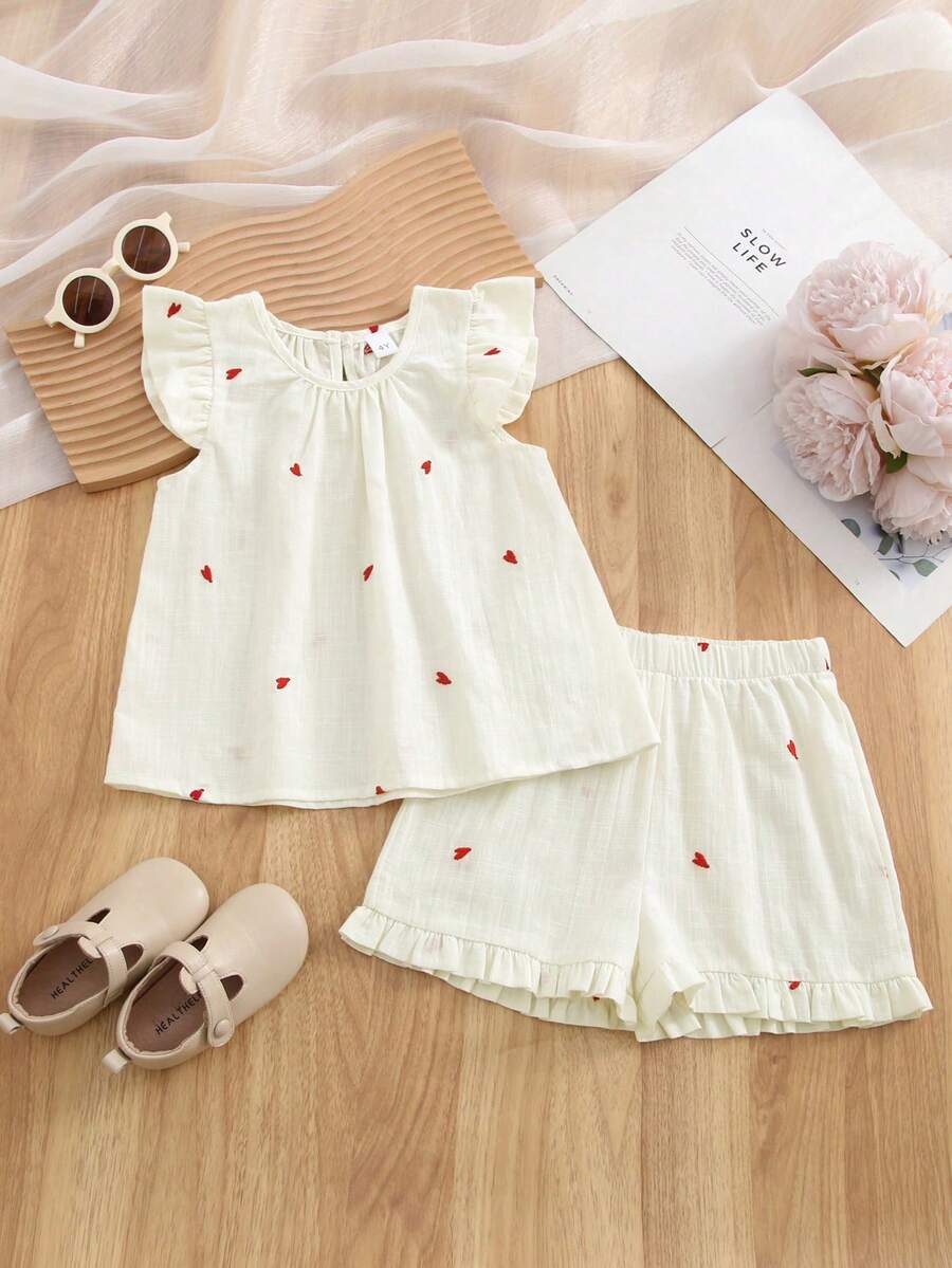 Bộ 2 món mùa hè cho bé gái, áo tay ngắn thêu hình trái tim, hàng mới về, gồm áo và quần short viền bèo nhún, thích hợp cho mùa hè. - Màu be - Xem 1