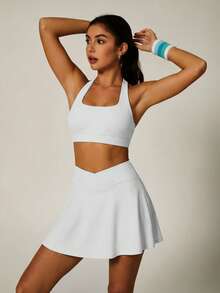 UONNOU 2 pezzi Set sportivo da donna, Canotta crop top + Minigonna modellante per primavera/estate, Imbottitura rimovibile, Design sexy schiena e spalle scoperte, Vita svasata, Tasche per tennis, Adatto per tennis, golf, sport, stile campus, palestra, yoga, casual, abbigliamento sportivo di moda - Bianco - Visualizzare 3