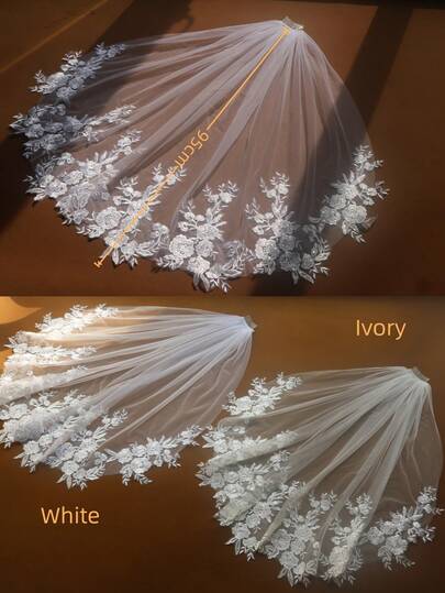 一件象牙色奢华长款柔软薄纱优雅新娘婚纱，配金属发梳和头纱
