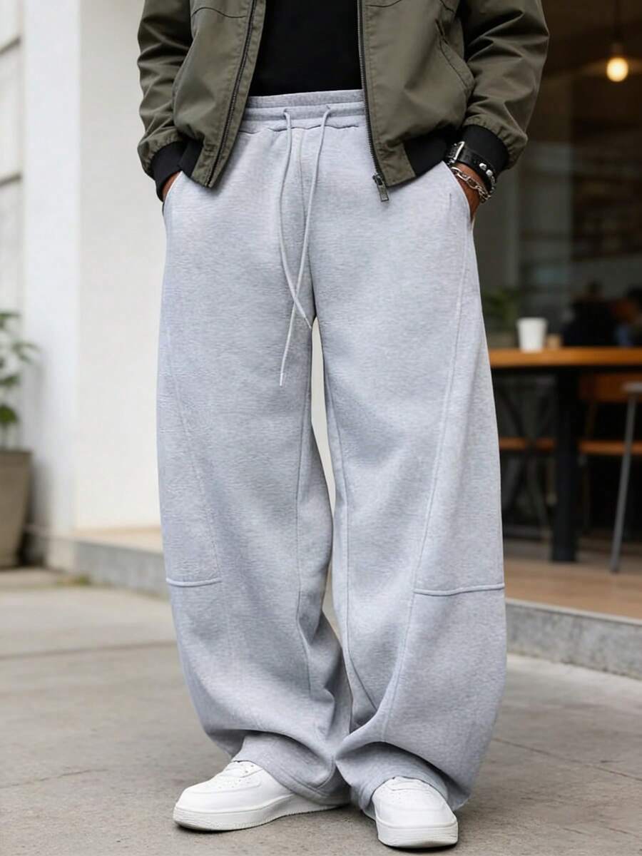 Pantalones deportivos casuales sueltos de uso urbano para hombres, con cintura elástica y diseño de cordón - Gris - Ver 1