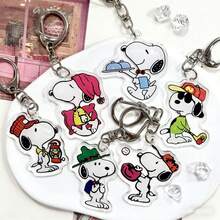 SNOOPY 这款2026新款史努比钥匙扣设计精致可爱，质地细腻耐用，非常适合挂在钥匙上或包包上。经典的卡通人物充满可爱和趣味，在日常生活中用途广泛，彰显个性。 - 彩色 - 查看 2