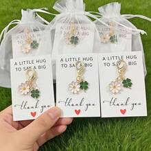 30pcs Spring Daisy & Clover Keychain Set - Delicate Floral Hanging Decor For Men & Women, Includes (10 Keychains + 10 Cards + 10 White Bags) Lobster Clasp Zinc Alloy Chain Bag Charm, Suitable For Easter, Thanksgiving, St. Patrick's Day, Mother's Day Gifts, Floral Favors & Birthday Presents Gifts For Mother, Father, Graduation, And Teacher - 10 Keychains + Cards + 10 Bags - View 2