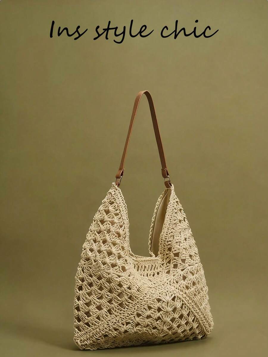 Questa borsa intrecciata in paglia nuova per la primavera/estate 2026 è di colore beige tinta unita, a spalla/a tracolla. Presenta una grande capacità, un design aperto e portatile, ed è sia elegante che pratica. Perfetta per uno stile rilassato e pronto per le vacanze, ideale per lo shopping, i viaggi e le passeggiate tranquille. - Beige - Visualizzare 1