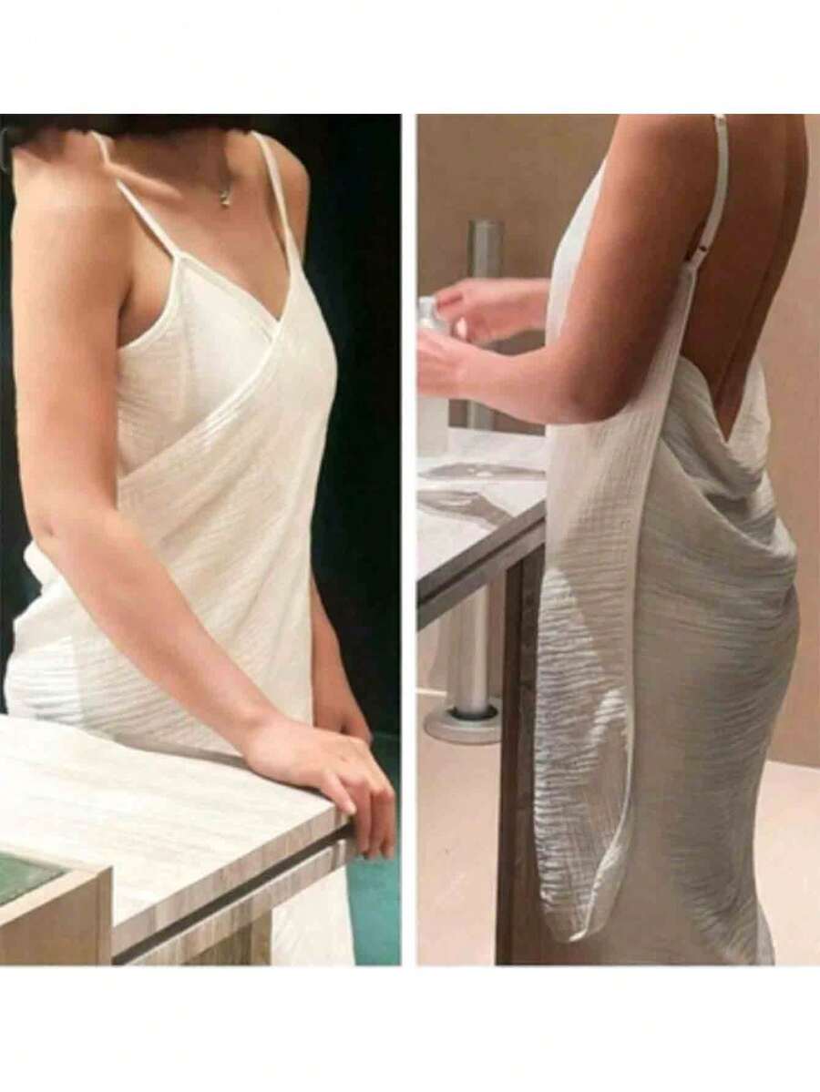 这款时尚舒适的浴袍采用轻盈弹力面料制成，由棉纱织成，既可裹身，也可作浴巾使用。它速干，非常适合用作沙滩巾——能够舒适地覆盖全身，长度也足够轻松展开。 - 白色 - 查看 1