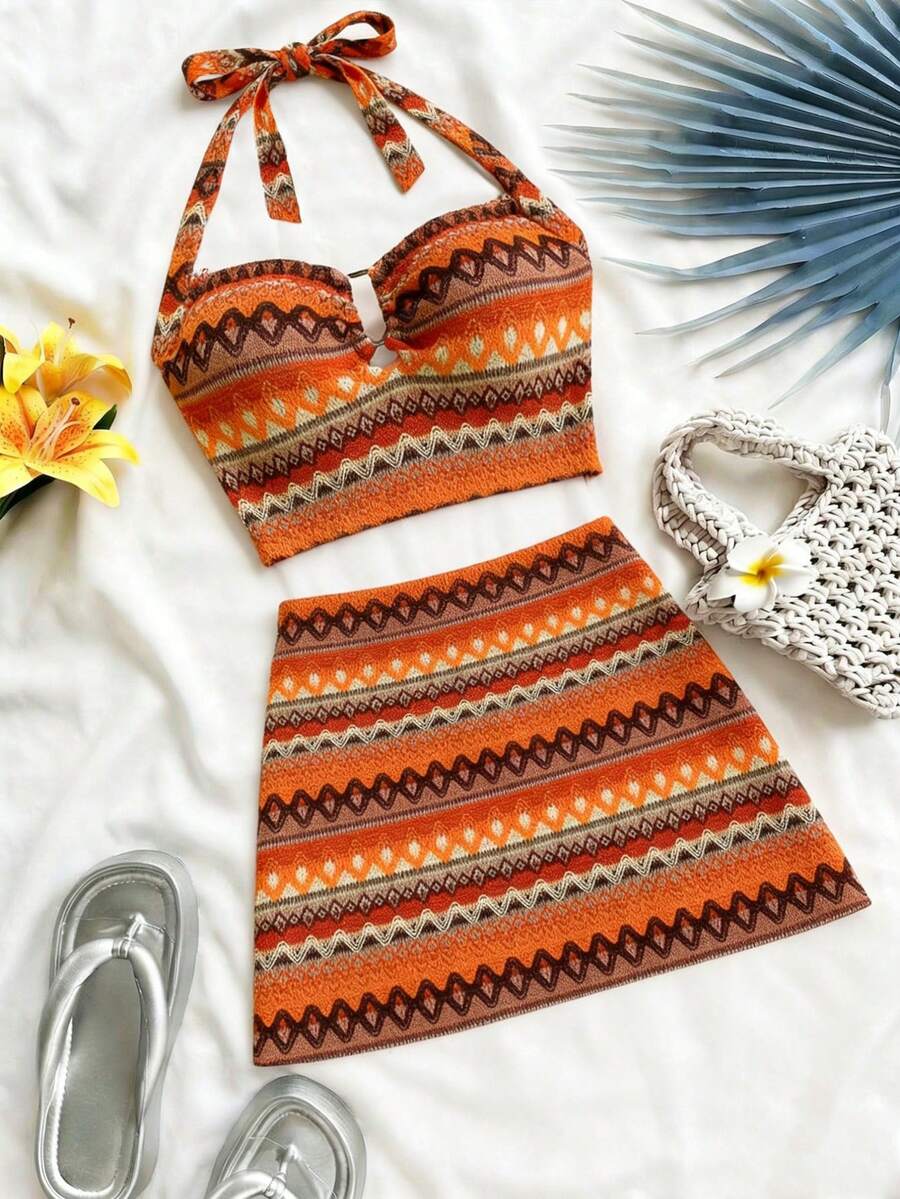 Bộ đồ hai mảnh nữ gồm áo crop top cổ yếm in họa tiết boho và chân váy ngắn, chất liệu co giãn vừa phải, thích hợp cho mùa hè đi biển. - trái cam - Xem 1